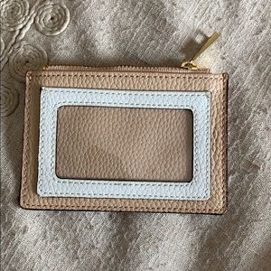 Brand New. Never Been Used Coin/Card Purse.